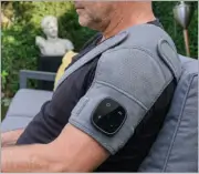Customer relaxing with Vital Shoulder Massager